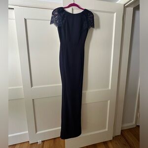 Navy blue lace mermaid gown. Wore once. Size small. Very stretchy.